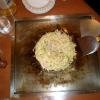 okonomiyaki cooking on the grill